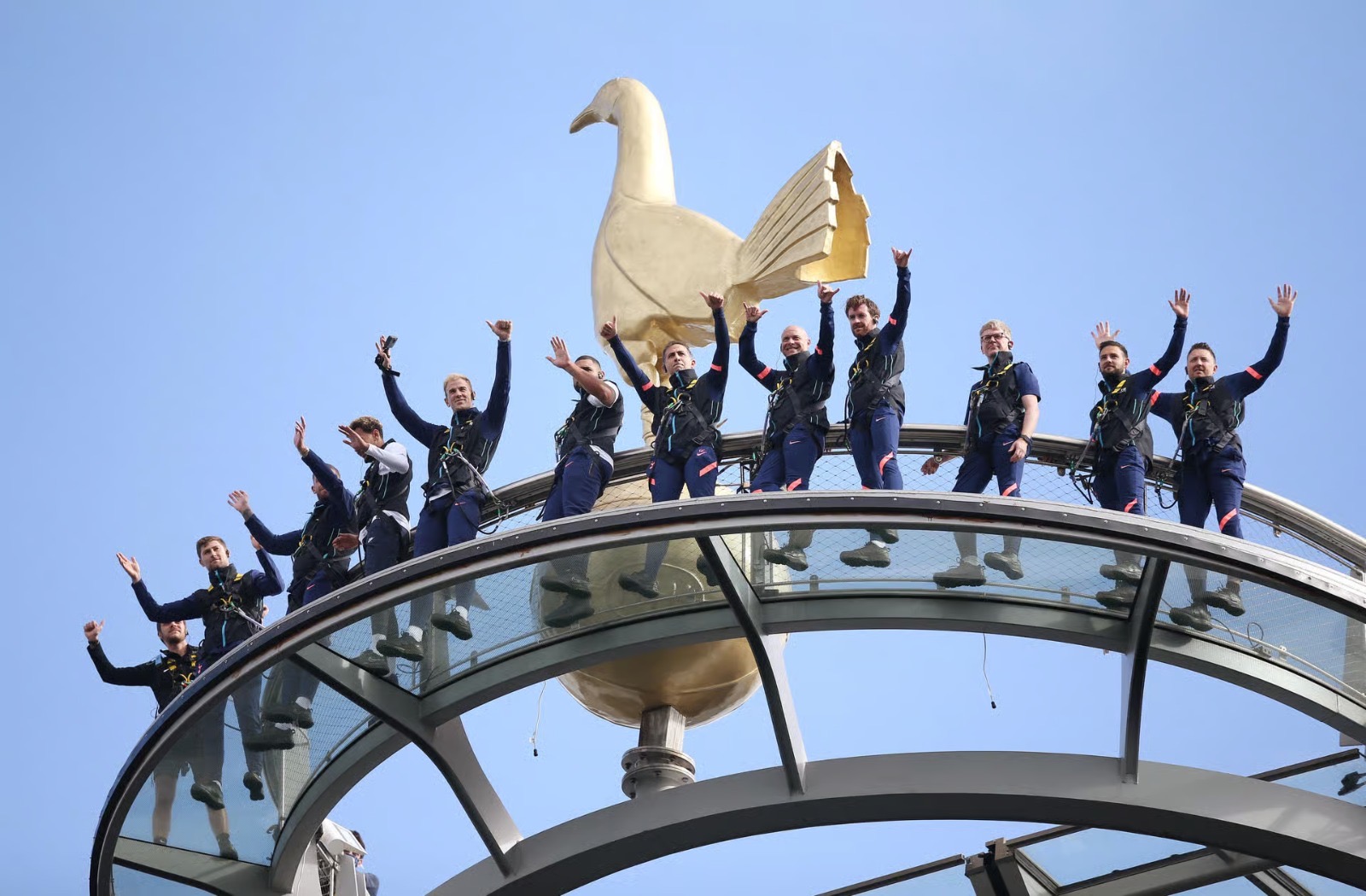 Skywalk group posing beside the golden cockerel on top of Tottenham Hotspur Stadium